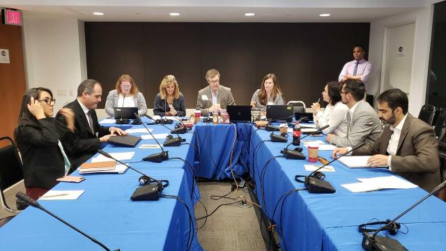 Mari Stull, center, gives her opening remarks during the inaugural session of the MIOA Executive Meeting in Washington, DC.